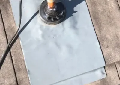 Metal flashing installed around a roof penetration