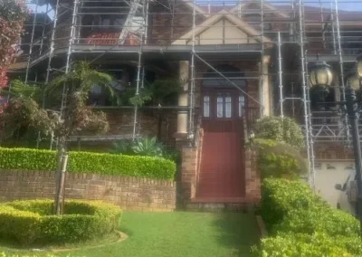 Residential roofing work underway on a scaffolded Shellharbour home