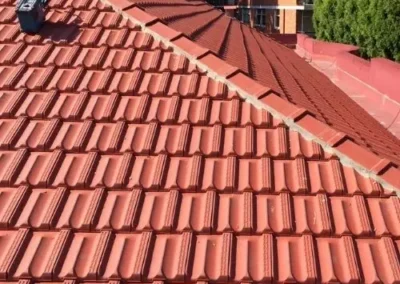 Restored terracotta roof tiles and ridge capping on a residential home