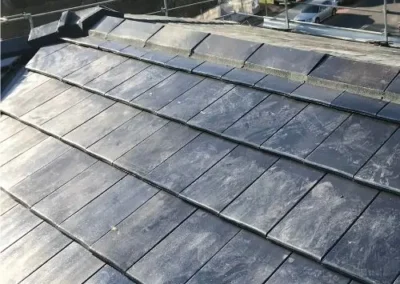 Large flat roof surface prepared with a dark waterproof finish