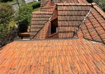Multi-section terracotta tiled roof on a residential property