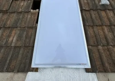 New roof window installed within an existing tiled roof