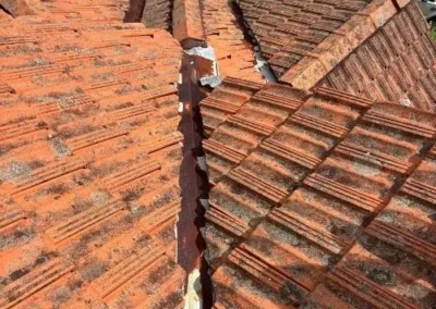 Weathered tiled roof valley requiring replacement